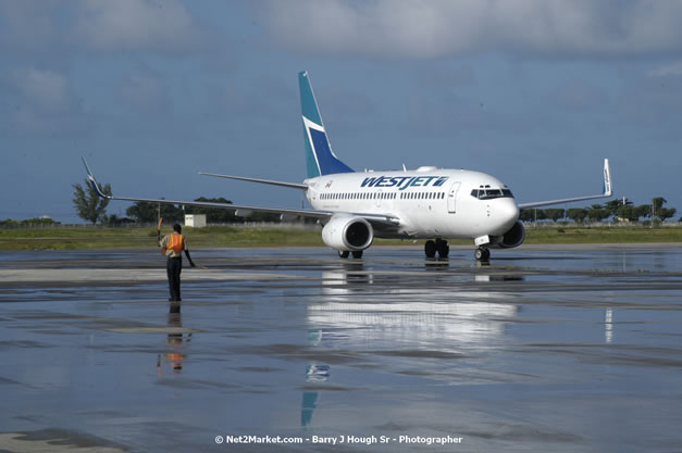 MBJ Airports Limited Welcomes WestJet Airlines - Inaugural Scheduled Service From Toronto Pearsons International Airport - Monday, December 10, 2007 - Sangster International Airport - MBJ Airports Limited, Montego Bay, Jamaica W.I. - Photographs by Net2Market.com - Barry J. Hough Sr, Photographer - Negril Travel Guide, Negril Jamaica WI - http://www.negriltravelguide.com - info@negriltravelguide.com...!